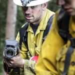 Wade Jones takes a temperature reading.