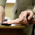 Anderson is fingerprinted.
