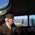 From the cockpit, retired Lt. Col. Ken Wheeler looks out the windows as B-17 bomber veterans take flight on the Aluminum Overcast.