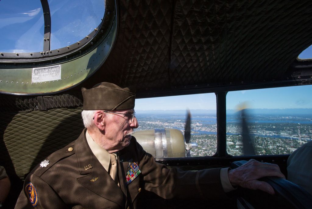 From the cockpit, retired Lt. Col. Ken Wheeler looks out the windows as B-17 bomber veterans take flight on the Aluminum Overcast.