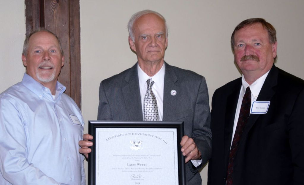 Will Rice of Catholic Community Services Northwest (left) and Snohomish County Executive Dave Somers (right) congratulate Larry Wewel as a President&rsquo;s &ldquo;Call to Service&rdquo; Lifetime Service Award recipient.