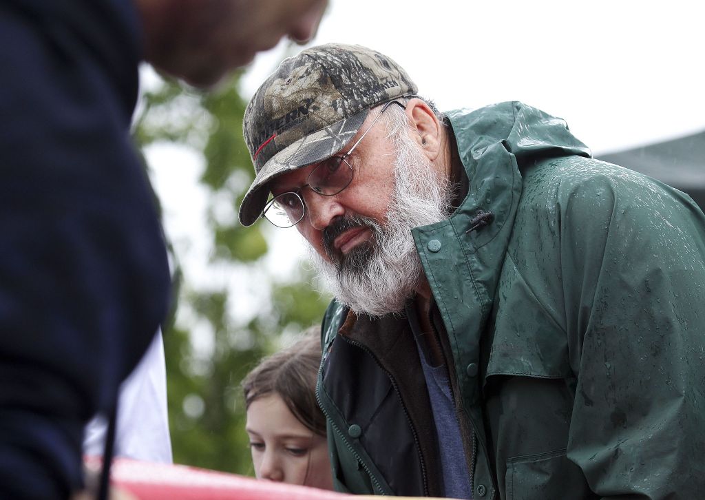 Ed Storts replaces the wheels on his great-granddaughter Peyton Calkins&rsquo; car at the Stanwood Camano Island Soap Box Derby on Saturday in Stanwood.