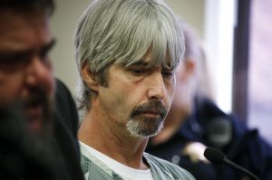 Tony Reed appears in court at the Snohomish County Courthouse in Everett on Friday. He pleaded guilty to two counts of first-degree rendering criminal assistance in the aftermath of the murder of Patrick Shunn and Monique Patenaude at their Oso home in April.
