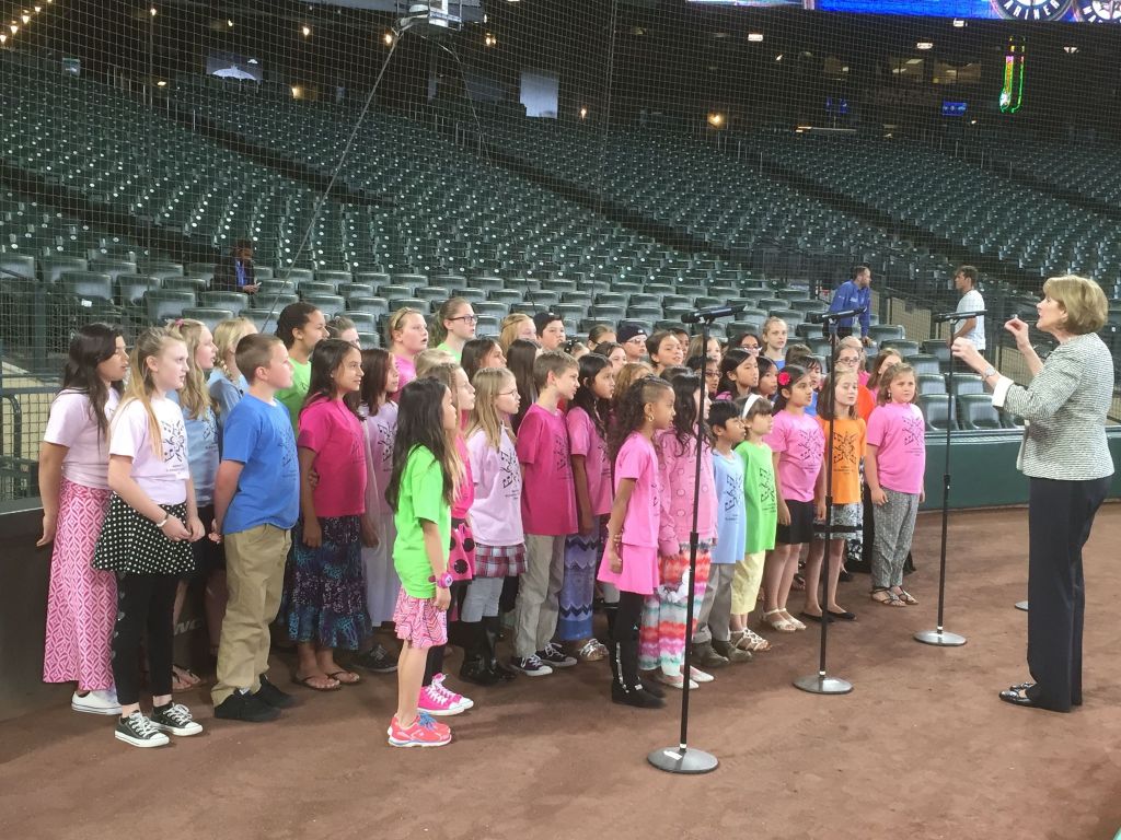 Contributed photo The Sunnyside Elementary School choir, under the direction of Brenda Ehrhardt, practices the national anthem before the start of the June 8 Seattle Mariners game at Safeco Field.
