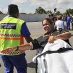 Marta Miguel is stretchered away upon her arrival at the Kota Kinabalu International Airport in Sabah, Malaysia, on Friday. Miguel was among the four who were rescued after their boat capsized off the northern coast of the island of Borneo.