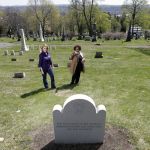 Kelly Grimaldi (left), historian at St. Agnes Cemetery, and Evelyn Kamili King, project manager for Schuyler Flatts Burial Ground Project, stand at a plot where 14 slaves will be reburied in Menands, New York.