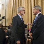 Transportation Security Administration chief Peter Neffenger (left) confers with House Homeland Security Committee Chairman Rep. Michael McCaul, R-Texas, on Capitol Hill in Washington on Wednesday, prior to testifying before the committee&rsquo;s hearing on long lines at airport checkpoints.