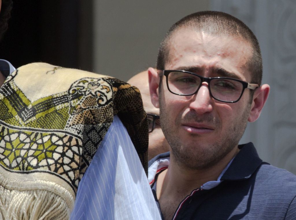 A relative of Salah Abu Laban, Sahar Qouidar, Ghassan Abu Laban and Reem al-Sebaei, all victims of EgyptAir flight 804, grieves following prayers for the dead at al Thawrah Mosque in Cairo on Friday.