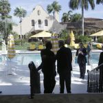 In this March 11 photo, former Republican presidential candidate Ben Carson (center left) talks with Donald Trump (center right) after a news conference at the Mar-A-Lago Club, in Palm Beach, Florida.