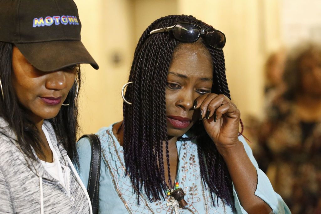 Kenneitha Lowe (right), sister of victim Mary Lowe, wipes her eye after a jury ruled for the death penalty Lonnie Franklin Jr. on Monday.