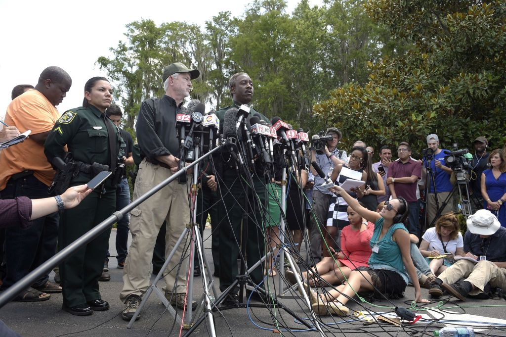 Nick Wiley, executive director of the Florida Fish & Wildlife Conservation Commission (left), and Orange County Sheriff Jerry Demings answer questions from reporters during a news conference Wednesday in Lake Buena Vista, Florida, after a toddler was dragged into the lake Tuesday evening by an alligator outside Disney&rsquo;s Grand Floridian Resort & Spa.