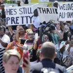 People Watch As The Funeral Procession For Muhammad Ali Passes In Front Of His Boyhood Home Friday, June 10, 2016, In Louisville, Ky. (Ap Photo/Mark Humphrey)