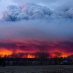 A wildfire moves towards the town of Anzac from Fort McMurray, Alberta, on Wednesday.