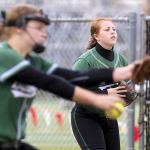 Mount Vernon’s Laura Sedano, playing first base, watches as teammate Paityn Cyr pitches during a game last month.