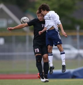 Mariner&rsquo;s Agustin Domingo (right) battles for the ball with Union&rsquo;s Mark Fabyenchuk during a first-round match of the 4A state boys soccer tournament Wednesday at Goddard Stadium in Everett.