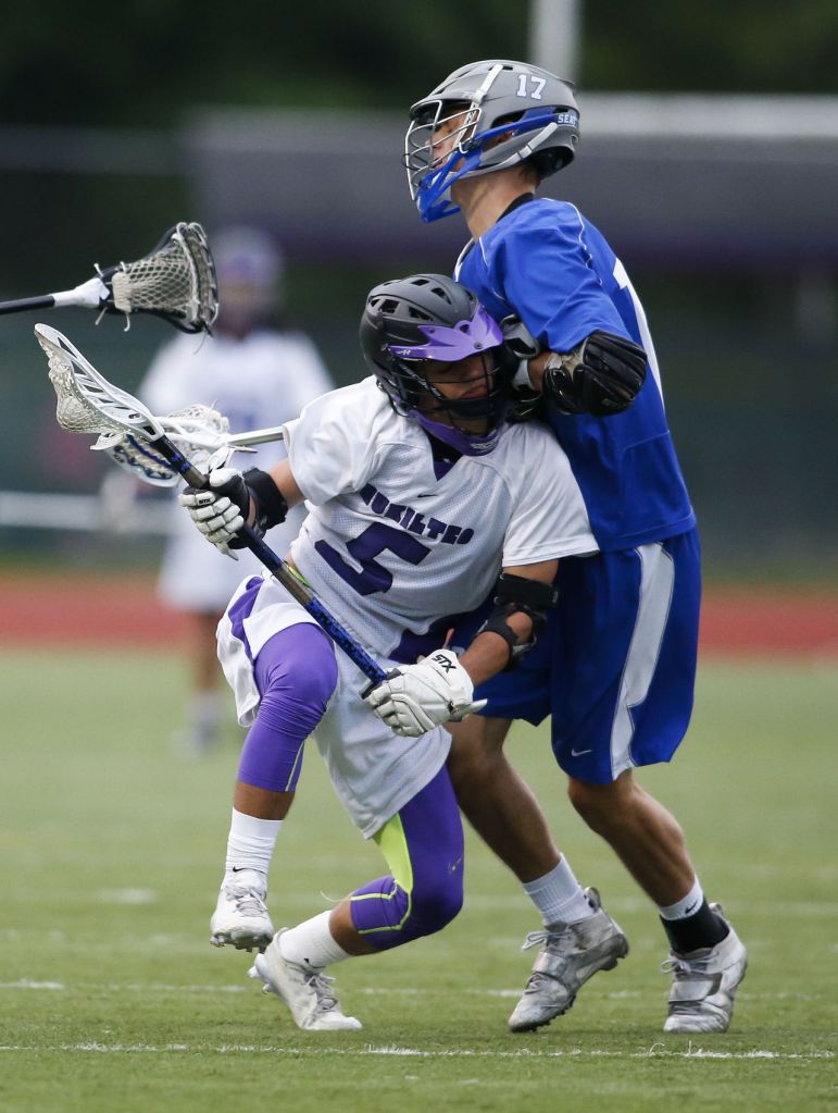 Kamiak&rsquo;s Alex Indelicato (left) runs into Seattle Prep&rsquo;s Alex Martin during a state tournament game Wednesday at Kamiak High School in Mukilteo.