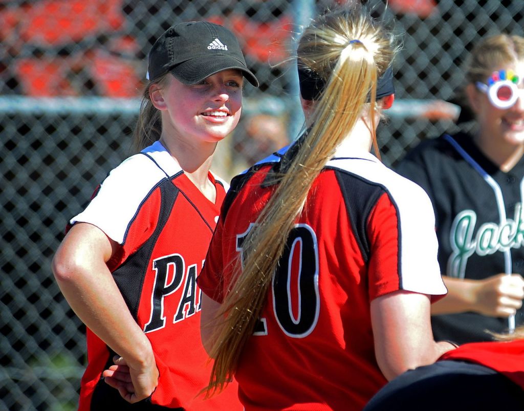 Snohomish sophomore center fielder Sami Reynolds (left) talks with fellow sophomore Joy Winston (10) prior to a game against Jackson on May 10.