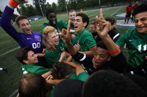 Edmonds-Woodway players celebrate their 2-0 victory over Glacier Peak following the 3A District 1 championship game on Saturday at Shoreline Stadium.