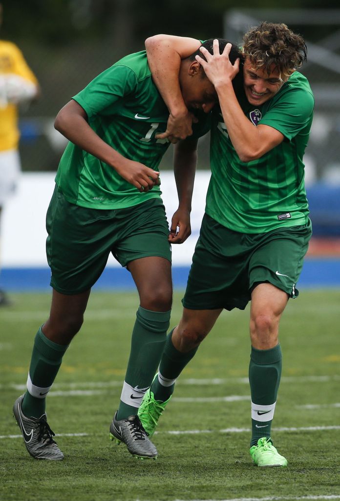 Edmonds-Woodway&rsquo;s Riketo Sokoli (right) congratulates teammate Lucas Teklemariam on his goal during the 3A District 1 championship game against Glacier Peak on Saturday at Shoreline Stadium.