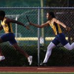 Mariner&rsquo;s Robel Anshebo (left) receives the handoff from teammate Mikkel Tadeo during the boys 4x100-meter relay at the Wesco 4A league championships on Friday at Snohomish High School.