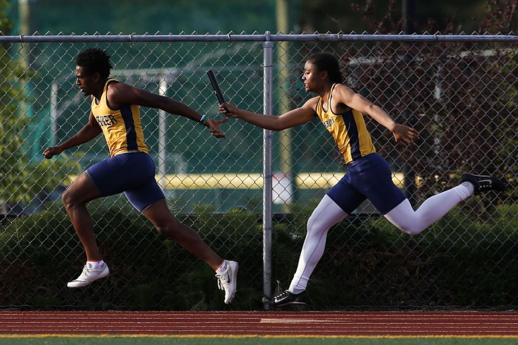 Mariner&rsquo;s Robel Anshebo (left) receives the handoff from teammate Mikkel Tadeo during the boys 4x100-meter relay at the Wesco 4A league championships on Friday at Snohomish High School.