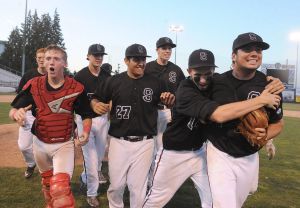 Snohomish pitcher Luke Kuna (far right) celebrates with teammates after the Panthers beat Cascade for the 4A District 1 championship Thursday at Everett Memorial Stadium.