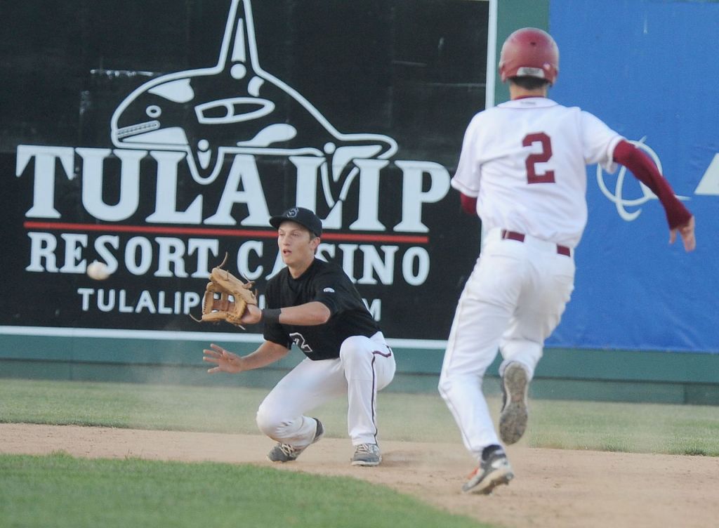 Snohomish&rsquo;s Kyle Sandifer reaches for the ball to tag out Cascade&rsquo;s Drew Swartz who tried to steal second base during the 4A District 1 championship Thursday at Everett Memorial Stadium.