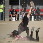 Cedarcrest&rsquo;s Michaela Carter stretches for the throw as Archbishop Murphy runner Katie Zwiefel slides and is unable to return to first base in time resulting in a double play during the sixth inning of game Wednesday at Archbishop Murphy High School. Cedarcrest won 8-6.