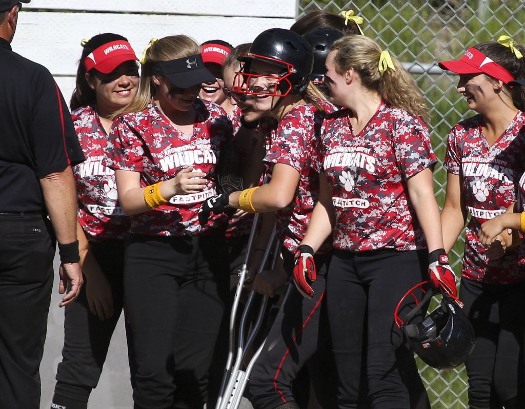 Archbishop Murphy&rsquo;s Alyson Matriotti (center) celebrates her home run with teammates in the first inning of a game Wednesday against Cedarcrest at Archbishop Murphy High School. Cedarcrest won 8-6.