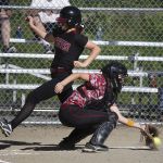 Cedarcrest&rsquo;s Michaela Carter (left) runs safely into home plate for an inside the park home run in the first inning as Archbishop Murphy catcher Alyson Matriotti fields the ball during a game Wednesday at Archbishop Murphy High School. Cedarcrest won 8-6.
