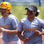Everett teammates Megan Gordon (left) and Alexis Rutter celebrate a run during a game against Auburn Mountainview in the first round of the 3A state softball tournament Friday in Lacey. Everett won 8-3.