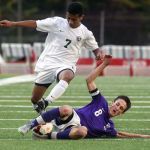 Garfield&rsquo;s Tommy Renehan makes a slide tackle against Edmonds Woodway&rsquo;s Armon Tenaw during a 3A state tournament match on May 20 at Edmonds Stadium.
