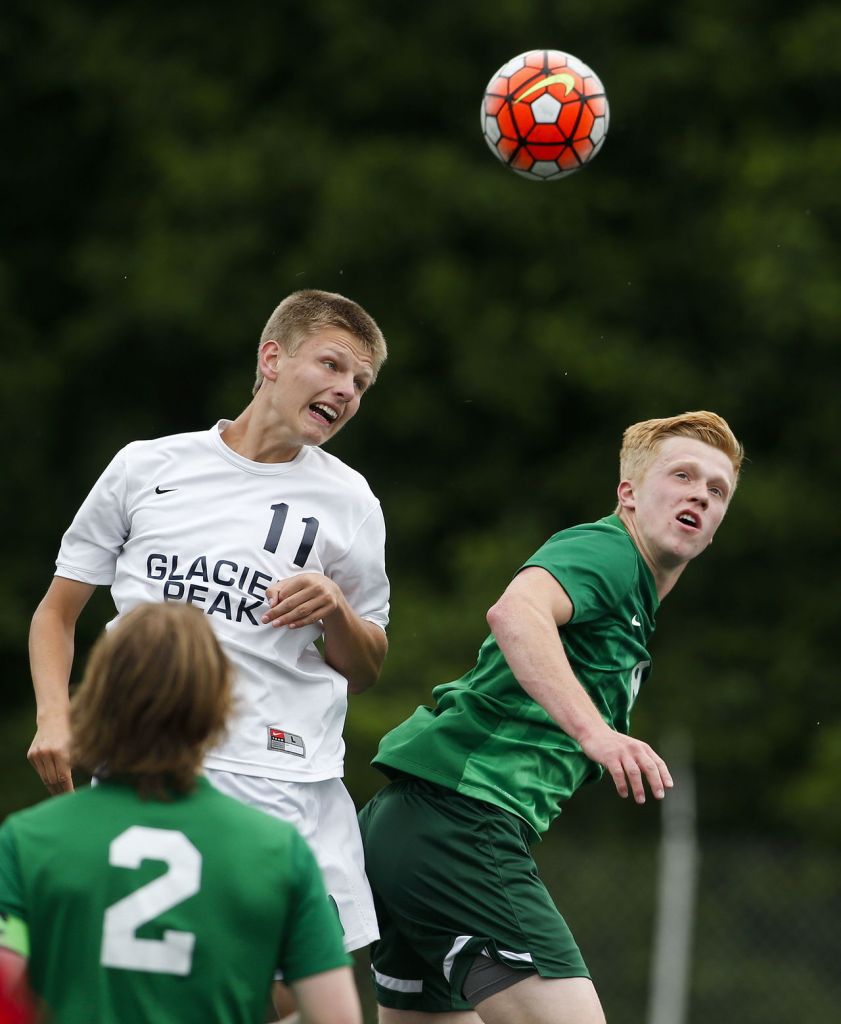 Edmonds-Woodway&rsquo;s Ethan Hopkins (right) and Glacier Peak&rsquo;s Tucker Davis go up for a header during the Wesco 3A championship game at Shoreline Stadium on May 14.