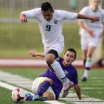 Edmonds-Woodway&rsquo;s Jose Aleman-Cruz (9) is tackled by Garfield&rsquo;s Aidan Chestnut during a 3A state tournament match on May 20 at Edmonds Stadium.