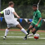 Edmonds-Woodway&rsquo;s Armon Tenaw (right) moves the ball past Glacier Peak&rsquo;s Connor Seed during the Wesco 3A championship game at Shoreline Stadium on May 14.