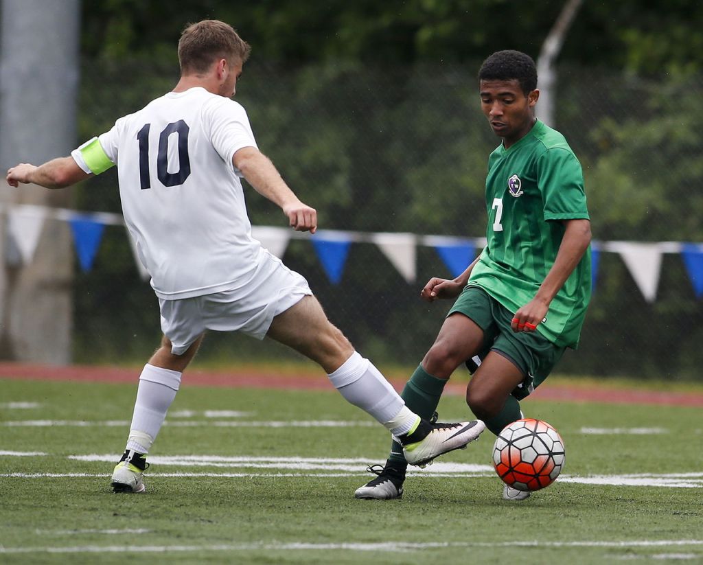 Edmonds-Woodway&rsquo;s Armon Tenaw (right) moves the ball past Glacier Peak&rsquo;s Connor Seed during the Wesco 3A championship game at Shoreline Stadium on May 14.