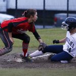 Glacier Peak&rsquo;s Harlee Carpenter (right) slides safely into third base as Marysville Pilchuck&rsquo;s Lilianne Fischer applies the tag during the Grizzlies&rsquo; 13-9 victory over the Tomahawks.