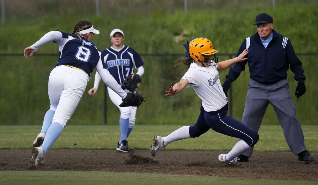 Meadowdale&rsquo;s Samantha Gregoryk (left) tags out Everett&rsquo;s Gabby Koehler after she was caught trying to advance to second base in the first inning of the 3A District 1 championship game on Thursday at Phil Johnson Fields in Everett.