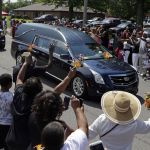 The funeral procession for Muhammad Ali makes its way down Muhammad Ali Boulevard in Louisville, Kentucky, on Friday.