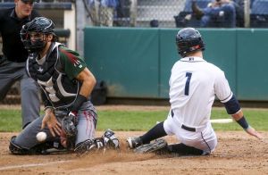 Everett&rsquo;s Jordan Cowan slides safely past Boise catcher Will Haynie during Thursday night&rsquo;s game at Everett Memorial Stadium.