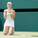 Angelique Kerber of Germany celebrates after beating Venus Williams of the United States in their women&rsquo;s singles match Thursday at the Wimbledon Tennis Championships in London. (AP Photo/Kirsty Wigglesworth)