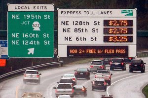 Signs show the rates for using the express toll lanes for traffic headed southbound on I-405 on Feb. 16 in Bothell. Reading the signs remains a point of confusion for many drivers. (AP Photo/Elaine Thompson)