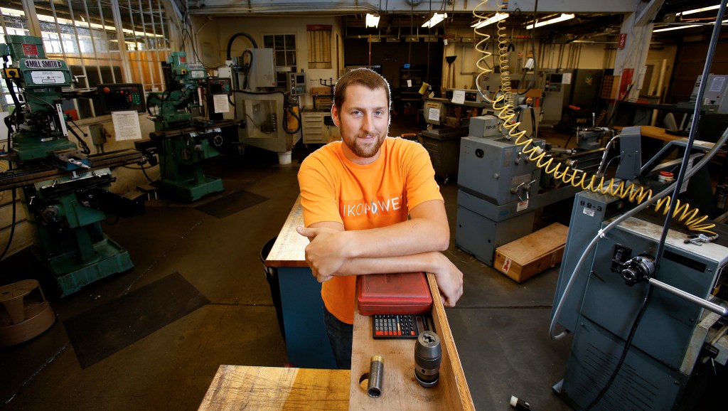 Andy Bronson / The Herald                                Daniel Parrish stands in a lab at the University of Washington Mechanical Engineering Annex Building. Parrish, an Everett Community College graduate, transferred to the UW where he now is pursuing a master&rsquo;s degree.