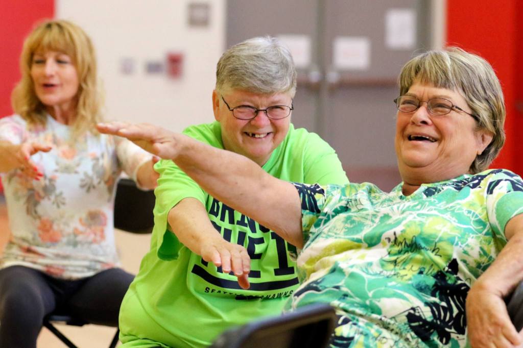 Instructor Vicki Venolia (from left), Tana Brosius and Kathy Banks work out during an aerobics class at North Middle School on Wednesday morning in Everett. The Carl Gipson Senior Center is closed for renovations, leaving several programs to find new homes for the summer. The center is scheduled to reopen at the end of August. (Kevin Clark / The Herald)