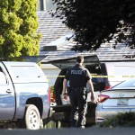 Crime-scene tape blocks the road at the intersection of 64th Place West and Webster Way in Mukilteo after the shootings July 30 which left three dead and one injured. Recordings of 911 calls were released on Tuesday. (Ian Terry / The Herald)