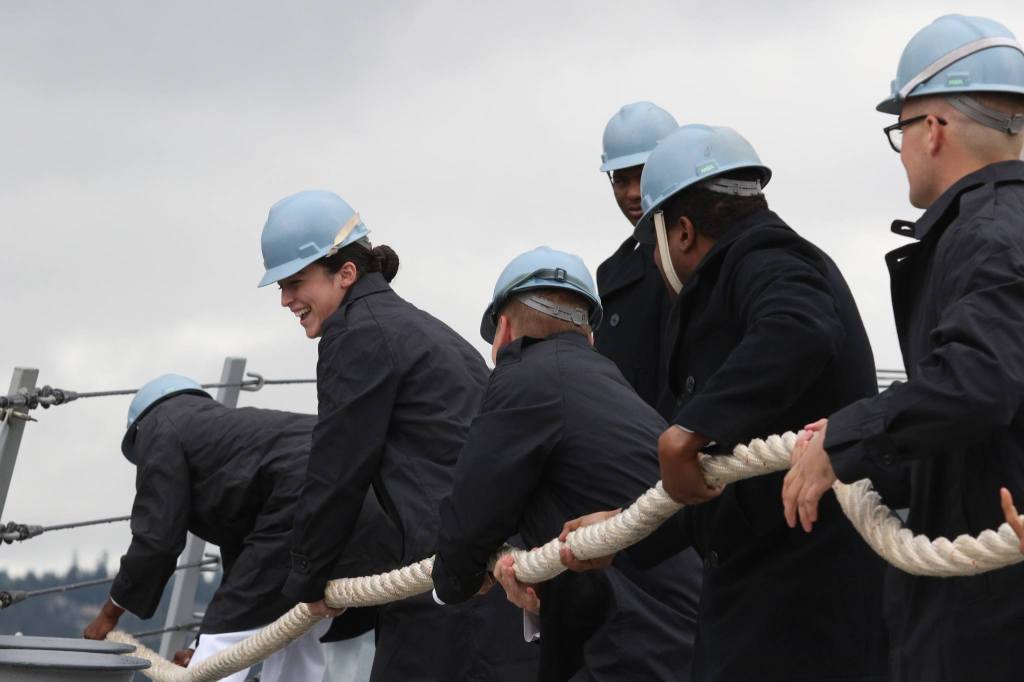 Sailors take in the lines as the USS Gridley gets ready for a trip to Seattle for Seafair on Tuesday. (Andy Bronson / The Herald)