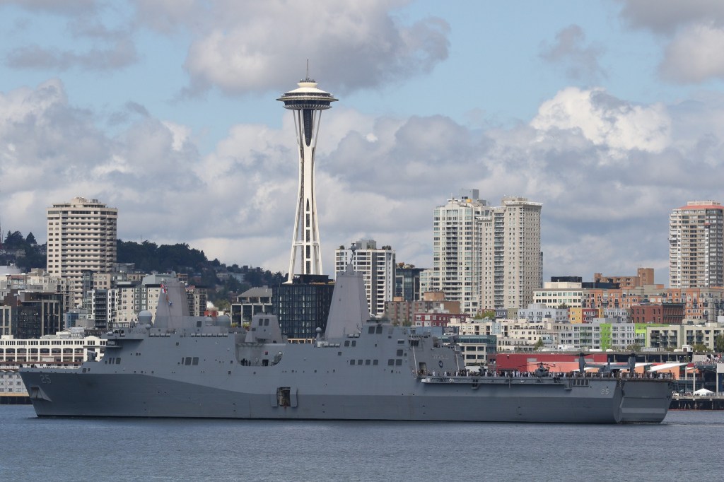 The USS Somerset cruises along the waterfront in Seattle before docking for Seafair on Tuesday. (Andy Bronson / The Herald)