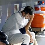Seattle Mariners relief pitcher Steve Cishek sits in the dugout after giving up a home run in the top of the ninth inning Monday night. (AP Photo/Elaine Thompson)