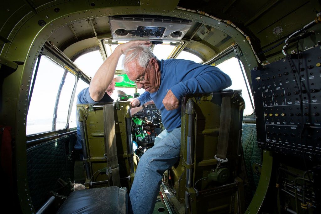 Bob Drew, 91, finds getting out of the pilot&rsquo;s seat in a B-25 Mitchell bomber a bit more difficult than when he flew the planes in World War II, after his flight in Maid in the Shade on the tarmac outside the Flying Heritage Collection on Monday in Everett. ( Andy Bronson / The Herald )