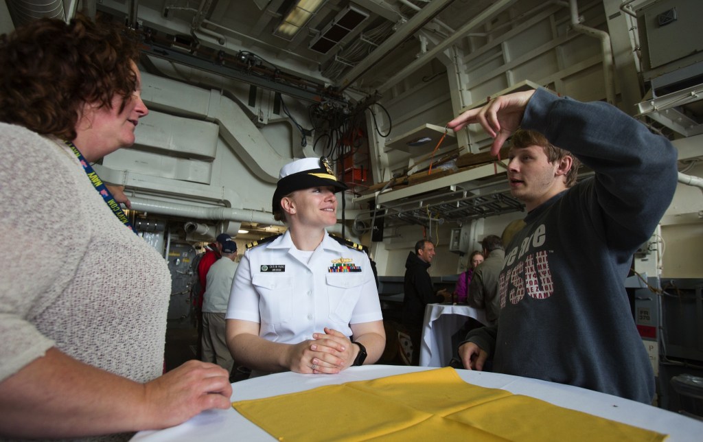 Lt. Caitlin Parks (center) chats with visitors aboard the USS Gridley during a cruise to Seattle for Seafair on Tuesday. (Andy Bronson / The Herald)
